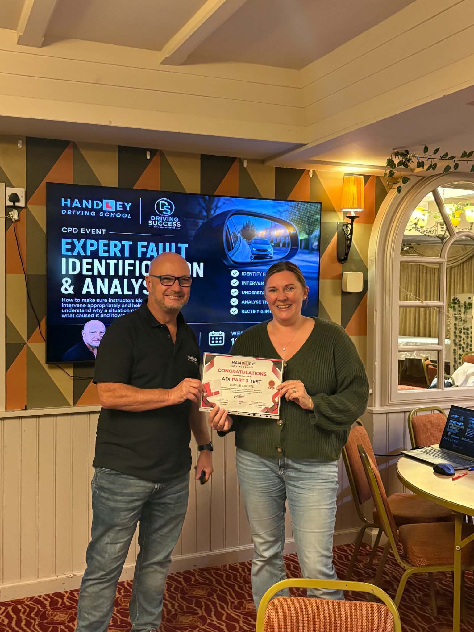 Dave Leverton presenting an ADI Part 3 pass certificate at a CPD event